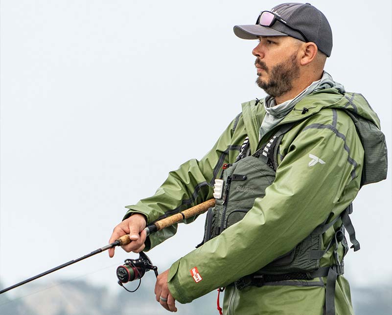 Angler wearing the Old Town Lure Angler II Fishing Life Jacket