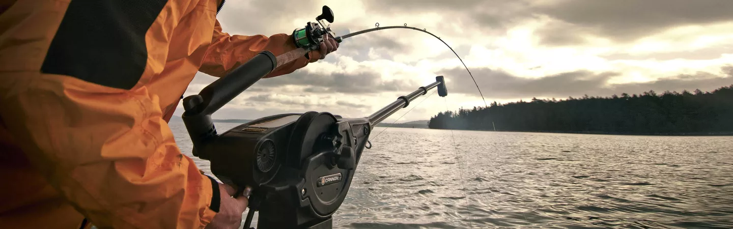 Angler setting a rod in the rod holder of the Magnum 10 electric downrigger