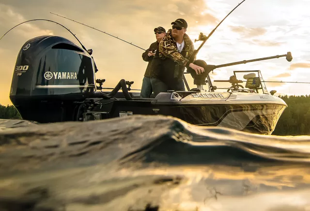 Anglers fishing using manual downriggers on bass boat